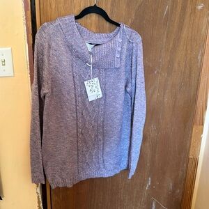 A brand new purple sweater